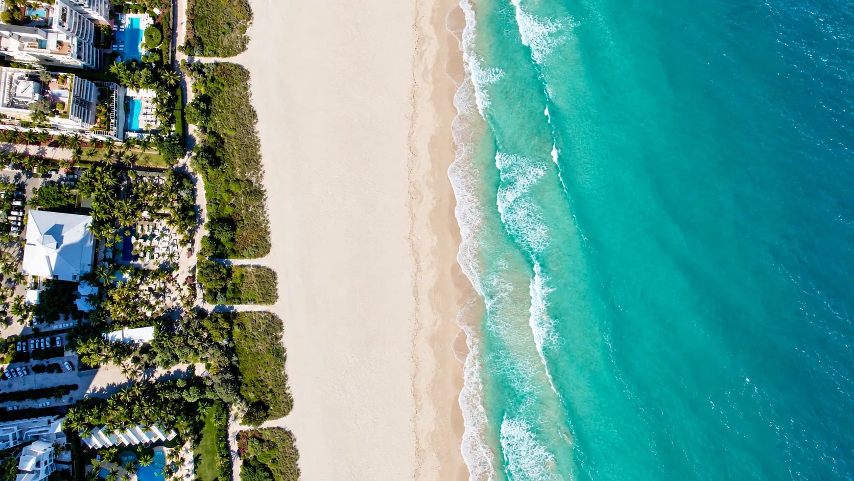 Miami Beach aerial view with turquoise water, palms, and pastel hotels