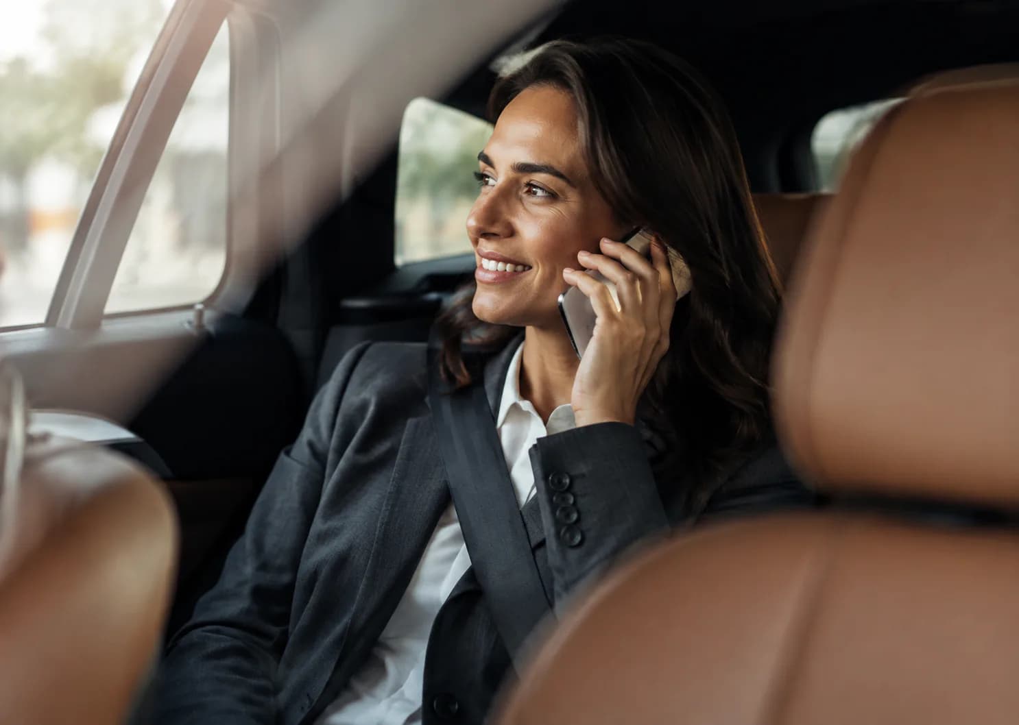 Business traveler enjoying a comfortable Connecticut black car service ride